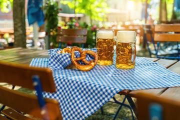 Beer mugs with fresh pretzels or brezen at Oktoberfest, Munich, Germany- Stock Photo or Stock Video of rcfotostock | RC Photo Stock