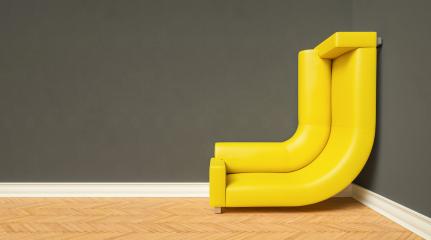 bended yellow couch in a corner of a small room climbing up the wall with plenty, with copyspace for your individual text.- Stock Photo or Stock Video of rcfotostock | RC Photo Stock