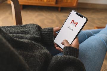 BERLIN, GERMANY AUGUST 2019: Woman holding a iPhone with Google Gmail app logo on the display. Gmail is a most popular free Internet e-mail service provided by Google.- Stock Photo or Stock Video of rcfotostock | RC-Photo-Stock