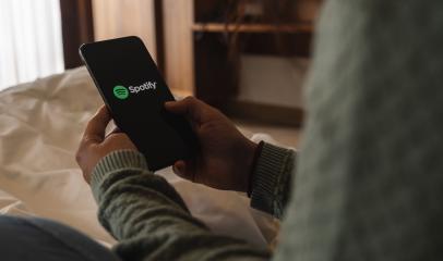 BERLIN, GERMANY AUGUST 2019: Woman holding a iPhone Xs opening spotify app in the bed, Spotify is a music service that offers legal streaming music.- Stock Photo or Stock Video of rcfotostock | RC-Photo-Stock