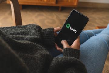 BERLIN, GERMANY AUGUST 2019: Woman holding a iPhone Xs opening spotify app, Spotify is a music service that offers legal streaming music.- Stock Photo or Stock Video of rcfotostock | RC Photo Stock