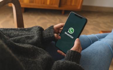 BERLIN, GERMANY AUGUST 2019: Woman holding a iPhone Xs opening Whatsapp app in a living room. WhatsApp messenger for sending messages via the Internet.- Stock Photo or Stock Video of rcfotostock | RC-Photo-Stock