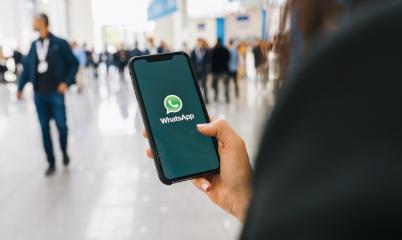 BERLIN, GERMANY AUGUST 2019: Woman holding a iPhone Xs opening Whatsapp app on a conference. WhatsApp messenger for sending messages via the Internet.- Stock Photo or Stock Video of rcfotostock | RC Photo Stock