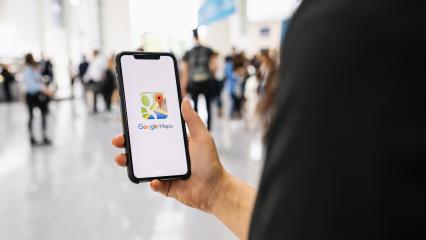 BERLIN, GERMANY JANUARY 2020: Hand Holding Smartphone with Google Maps application o. Google Maps is a service that provides information about geographical regions and sites around the world.- Stock Photo or Stock Video of rcfotostock | RC-Photo-Stock
