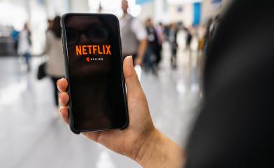 BERLIN, GERMANY JANUARY 2020: Netflix app on Apple iPhone. Young woman is browsing the movie video library what to watch.- Stock Photo or Stock Video of rcfotostock | RC-Photo-Stock