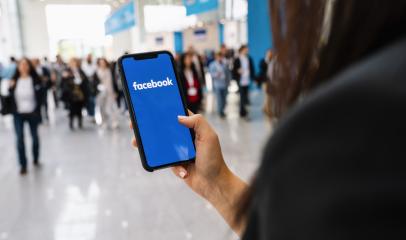 BERLIN, GERMANY JANUARY 2020: Woman hand holding iphone Xs with logo of Facebook application in a pedestrian zone. Facebook is an online social networking service founded February 2004 Mark Zuckerberg- Stock Photo or Stock Video of rcfotostock | RC-Photo-Stock