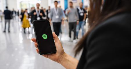 BERLIN, GERMANY JANUARY 2020: Woman holding a iPhone Xs opening spotify app, Spotify is a music service that offers legal streaming music.- Stock Photo or Stock Video of rcfotostock | RC-Photo-Stock