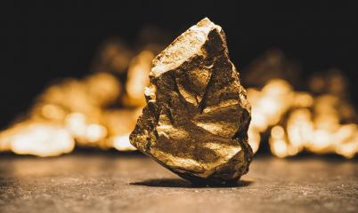 big gold nugget in front of a mound of gold -  finance concept- Stock Photo or Stock Video of rcfotostock | RC Photo Stock