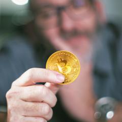 Bitcoin in hand of a businessman : Stock Photo or Stock Video Download rcfotostock photos, images and assets rcfotostock | RC-Photo-Stock.: