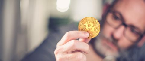 Bitcoin in hand of a businessman- Stock Photo or Stock Video of rcfotostock | RC-Photo-Stock
