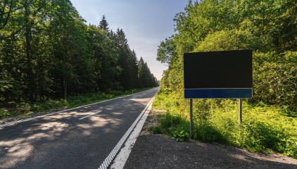 Blank Road Sign at the street in to the woods, copyspace for your individual text.- Stock Photo or Stock Video of rcfotostock | RC-Photo-Stock