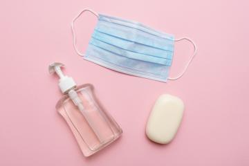 Blue medical mask, soap and fluit soap on pink background. Concept of protection against corona virus covid 19 pandemic.- Stock Photo or Stock Video of rcfotostock | RC Photo Stock