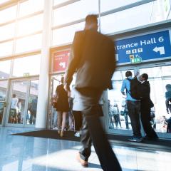 Blurred business man at a trade fair- Stock Photo or Stock Video of rcfotostock | RC Photo Stock