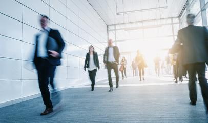 Blurred business people at a trade fair entrance - Stock Photo or Stock Video of rcfotostock | RC Photo Stock