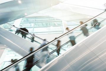 Blurred business people on a escalator- Stock Photo or Stock Video of rcfotostock | RC Photo Stock
