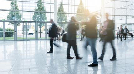 Blurred business people walking at a trade fair- Stock Photo or Stock Video of rcfotostock | RC Photo Stock