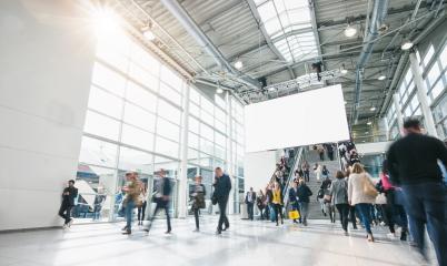 blurred people at a trade show, including copy space banner - Stock Photo or Stock Video of rcfotostock | RC Photo Stock