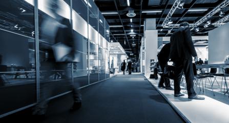 blurred people walking between Trade Fair Stands- Stock Photo or Stock Video of rcfotostock | RC Photo Stock