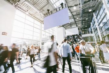 blurred people walking in a modern hall of a trade fair- Stock Photo or Stock Video of rcfotostock | RC Photo Stock