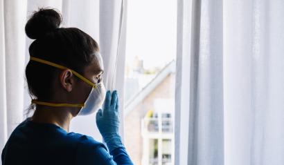 Bored woman in corona quarantine with protection mask ffp2 looking out of window to the street - Stock Photo or Stock Video of rcfotostock | RC-Photo-Stock