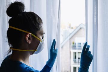 Bored woman in corona quarantine with protection mask fftp2 looking out of a window to the village  : Stock Photo or Stock Video Download rcfotostock photos, images and assets rcfotostock | RC-Photo-Stock.: