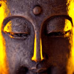 Buddha statue head close-up with glow against black background- Stock Photo or Stock Video of rcfotostock | RC-Photo-Stock