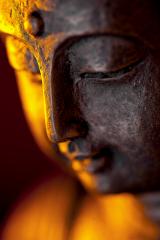 Buddha statue head close-up with glow against black background : Stock Photo or Stock Video Download rcfotostock photos, images and assets rcfotostock | RC-Photo-Stock.: