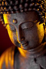 Buddha statue head close-up with glow against black background- Stock Photo or Stock Video of rcfotostock | RC-Photo-Stock