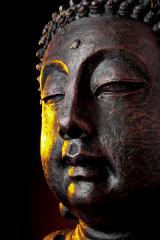 Buddha statue head close-up with glow against black background- Stock Photo or Stock Video of rcfotostock | RC Photo Stock