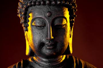 Buddha statue head with glow against black background- Stock Photo or Stock Video of rcfotostock | RC Photo Stock