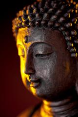 Buddha statue head with glow against black background- Stock Photo or Stock Video of rcfotostock | RC Photo Stock