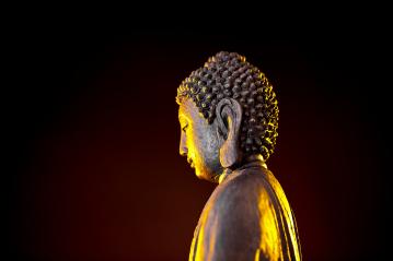 Buddha statue with glow against black background : Stock Photo or Stock Video Download rcfotostock photos, images and assets rcfotostock | RC-Photo-Stock.: