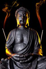 Buddha statue with glow and incense sticks against black background- Stock Photo or Stock Video of rcfotostock | RC Photo Stock
