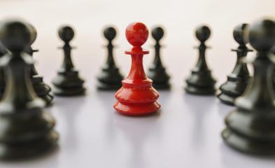 bullying concept, red pawn of chess, standing out from the crowd of blacks- Stock Photo or Stock Video of rcfotostock | RC Photo Stock