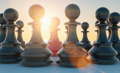 bullying concept, red pawn of chess, standing out from the crowd of blacks with sunflare- Stock Photo or Stock Video of rcfotostock | RC-Photo-Stock