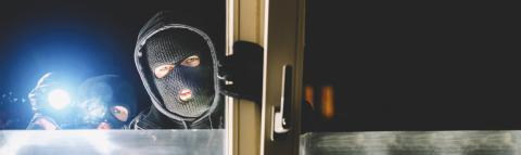 Burglar at night with flashlight at window of the house, with copy space, banner size- Stock Photo or Stock Video of rcfotostock | RC-Photo-Stock