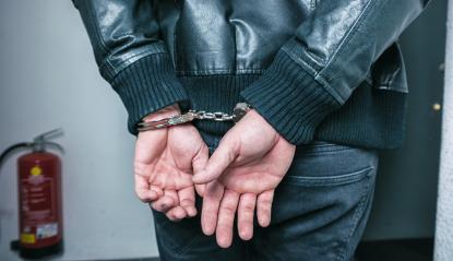 Burglar hands locked in handcuffs : Stock Photo or Stock Video Download rcfotostock photos, images and assets rcfotostock | RC Photo Stock.: