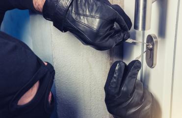 burglar holding Lock-picker to open a housedoor : Stock Photo or Stock Video Download rcfotostock photos, images and assets rcfotostock | RC Photo Stock.: