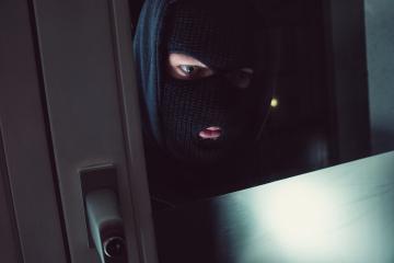 Burglar in a mask looking into the House at night- Stock Photo or Stock Video of rcfotostock | RC-Photo-Stock