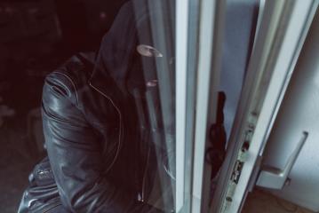 Burglar looking to a open window of a house at night- Stock Photo or Stock Video of rcfotostock | RC-Photo-Stock
