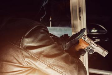 burglar pointing a gun out of the window  : Stock Photo or Stock Video Download rcfotostock photos, images and assets rcfotostock | RC Photo Stock.: