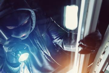 Burglar using flashlight and leather coat to breaking in a house at night- Stock Photo or Stock Video of rcfotostock | RC-Photo-Stock