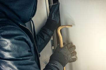 burglar with crowbar breaking and entering a victim's house door at night : Stock Photo or Stock Video Download rcfotostock photos, images and assets rcfotostock | RC Photo Stock.: