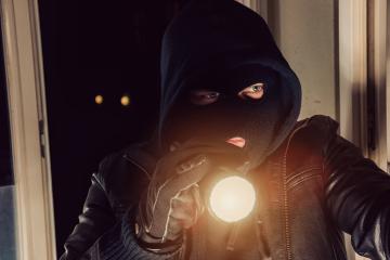 Burglar with flashlight looking through the House : Stock Photo or Stock Video Download rcfotostock photos, images and assets rcfotostock | RC-Photo-Stock.: