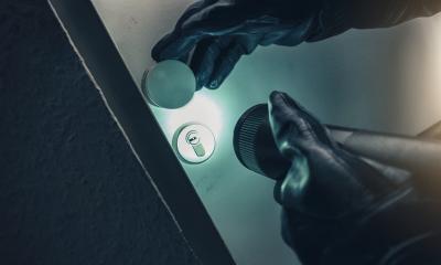 burglar with torch entering into a house door - Stock Photo or Stock Video of rcfotostock | RC-Photo-Stock