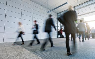 Business people walking in the tradeshow corridor- Stock Photo or Stock Video of rcfotostock | RC Photo Stock