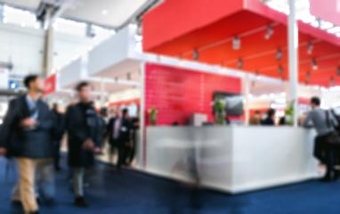 business people walking in trade fair booth Intentionally blurred background- Stock Photo or Stock Video of rcfotostock | RC Photo Stock