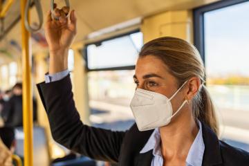 business woman wear surgical FFP2 mask face to protect herself while commuting in the metro or train- Stock Photo or Stock Video of rcfotostock | RC Photo Stock