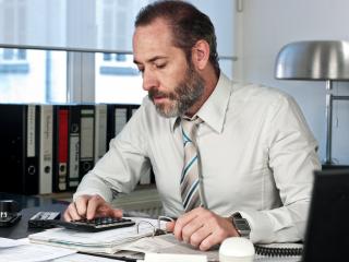 Businessman calculating finance- Stock Photo or Stock Video of rcfotostock | RC-Photo-Stock