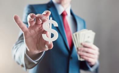 Businessman holding a dollar sign with a  Spread of Cash- Stock Photo or Stock Video of rcfotostock | RC-Photo-Stock